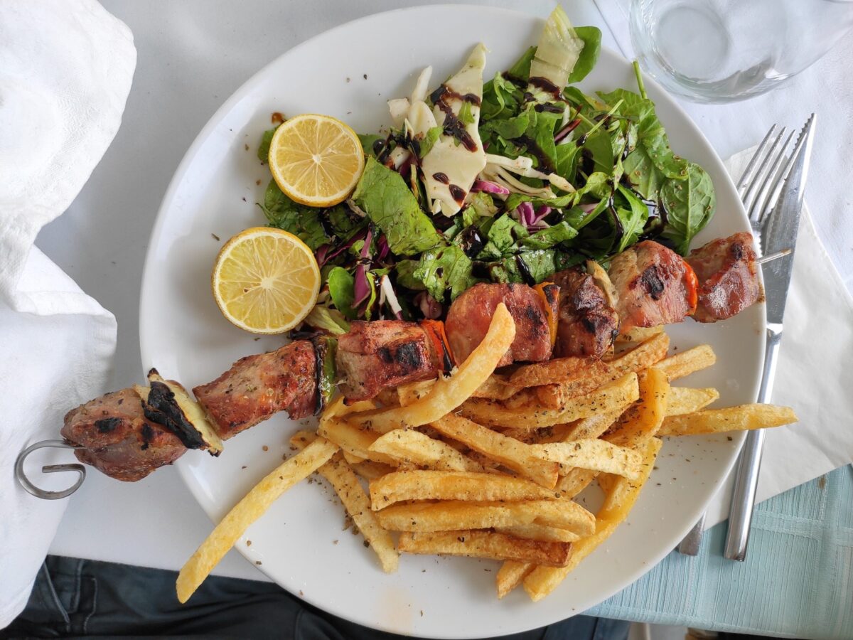 Greece food Souvlaki with french fries: Photo by Joshua Kettle on Unsplash