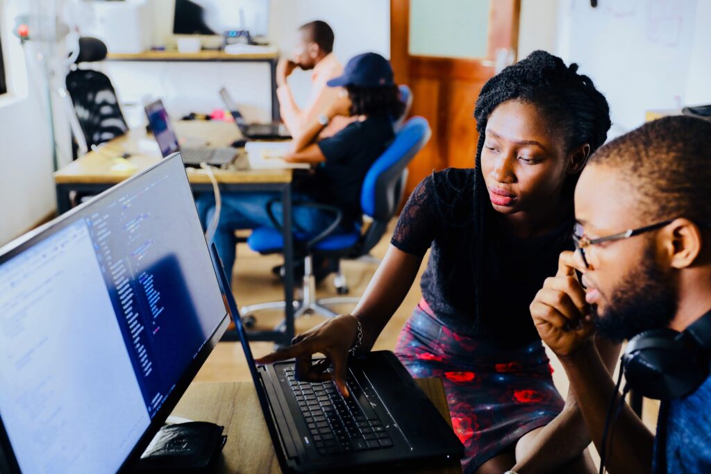 Two people Working on the computer: Editing: Photo by Desola Lanre-Ologun on Unsplash