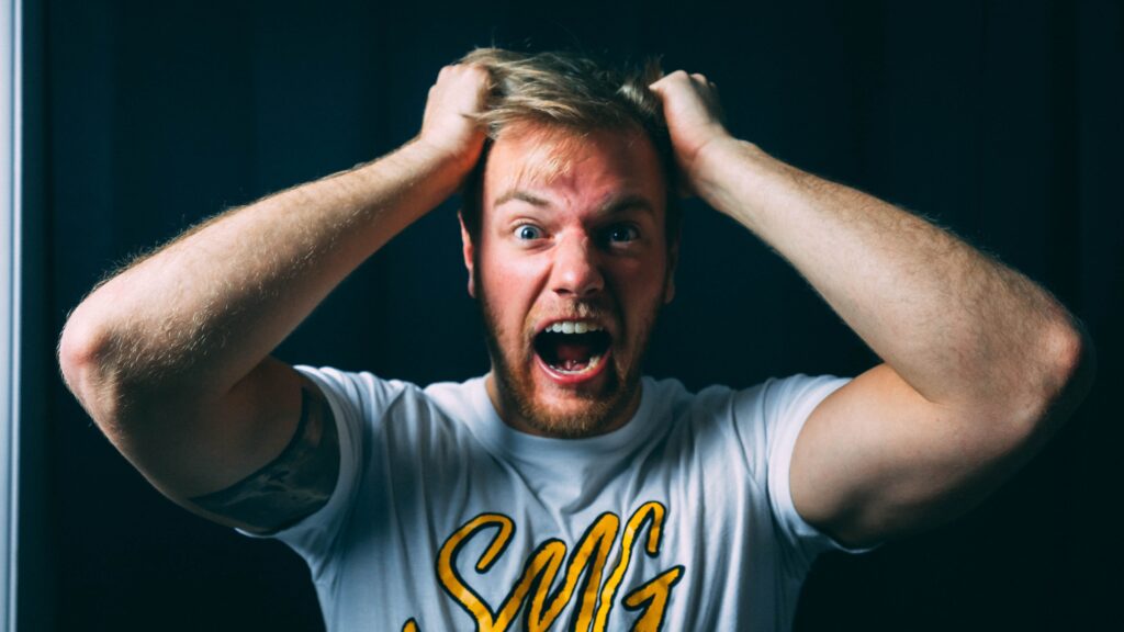 Upset man, Pull Out Hair Photo by Ryan Snaadt on Unsplash