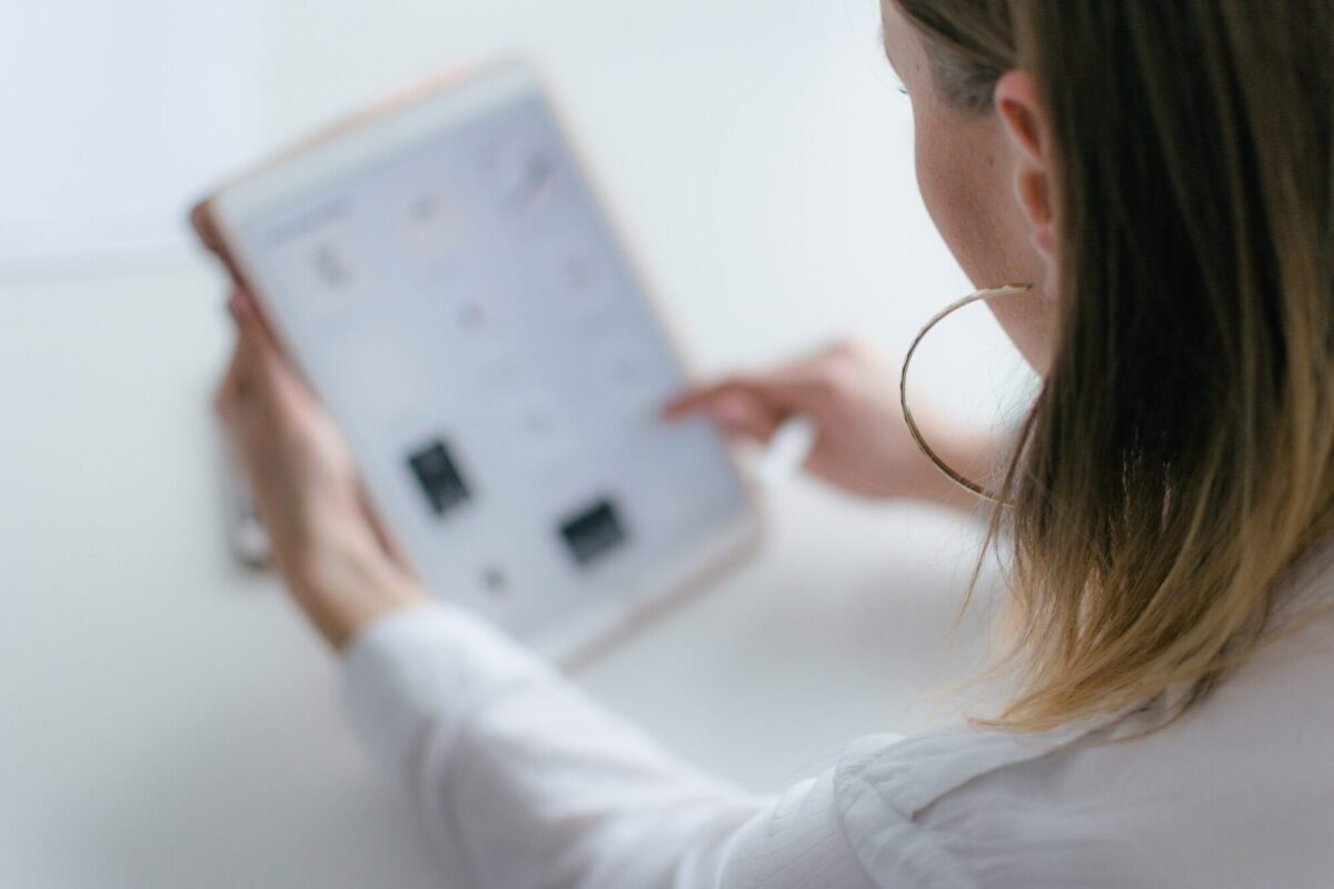 Women on tablet: Photo by Marek Levák on Unsplash