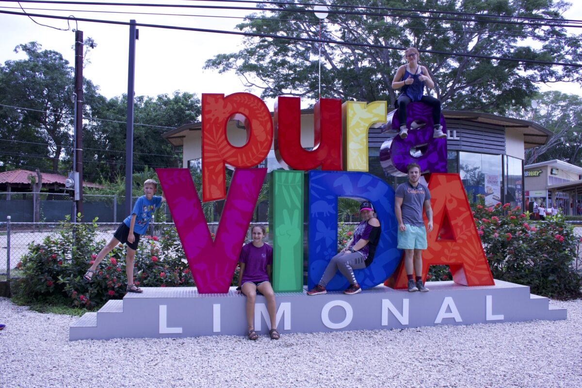 Costa Rica Limonal sign with family on it: Photo by Steve Page